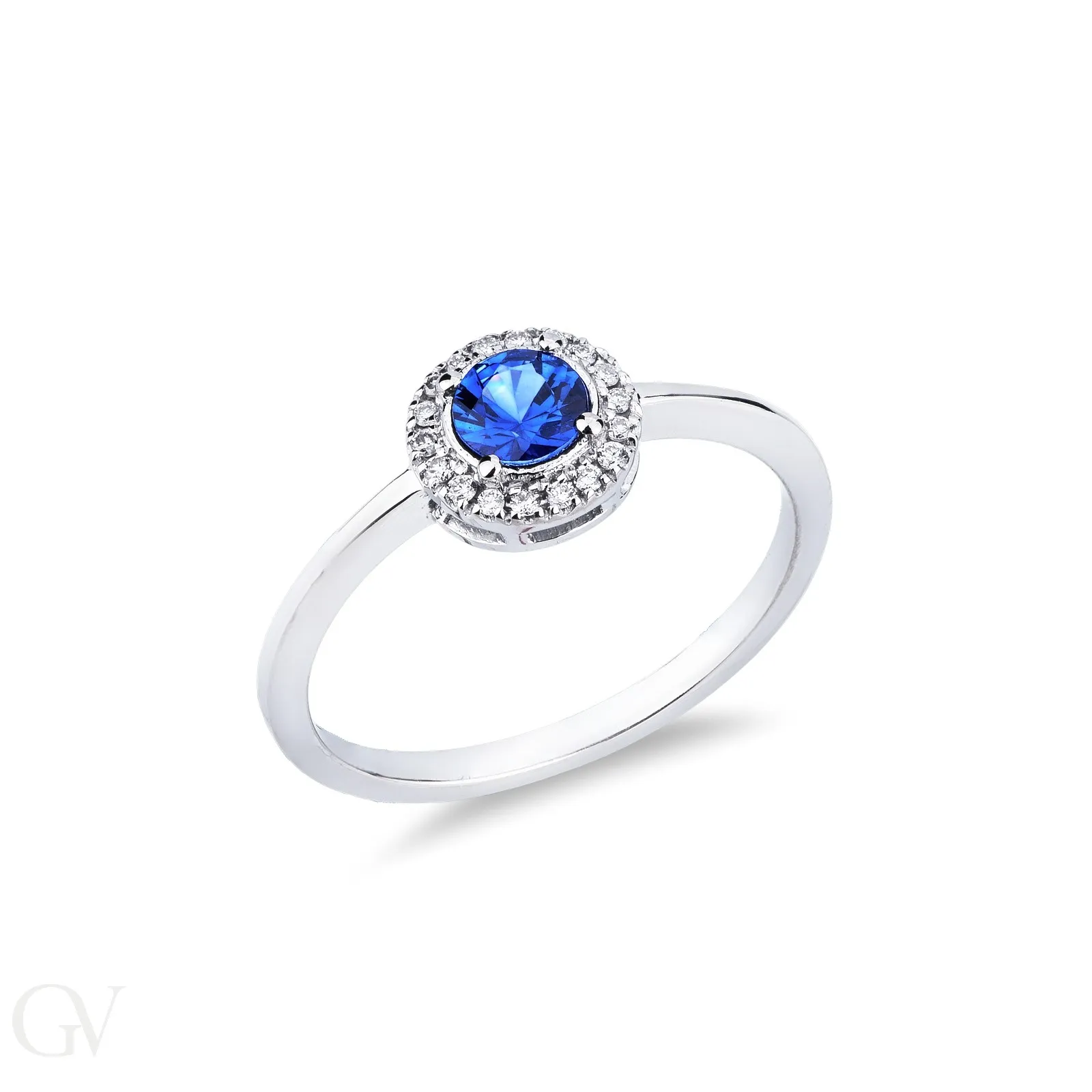 Anello in oro bianco 18k con zaffiro blu centrale e contorno in diamanti